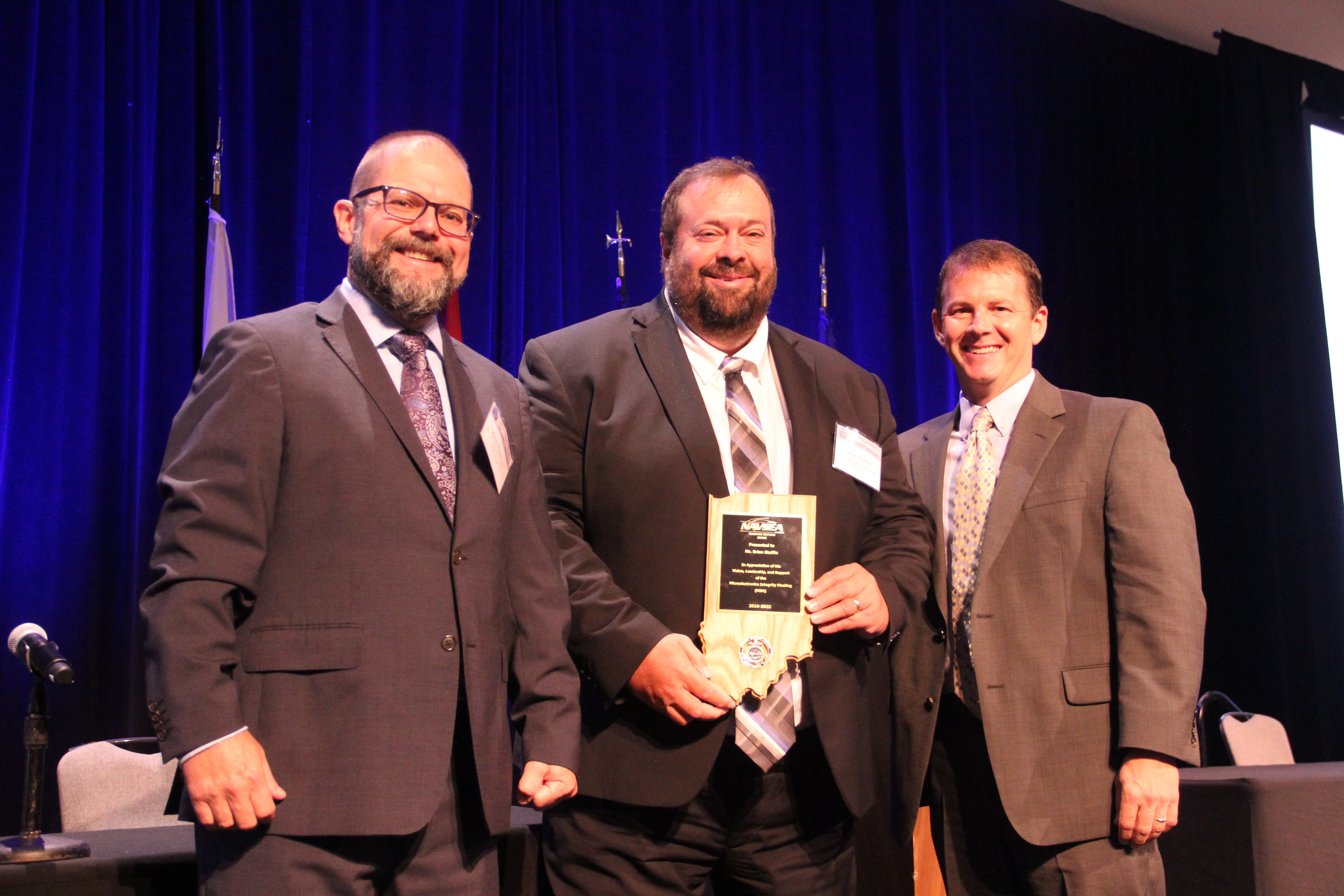Brian Stuffle (center) receives appreciation plaque from Mark Thomas (left) and Dr. Kyle Werner (right)